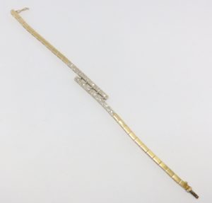 Brazalete en Oro Bicolor con 14 Diamantes de 0,55 ct. Color, I-J. Pureza, SI1.