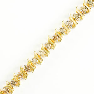 Brazalete Riviere, en Oro con 35 Diamantes talla Brillante de 4,55 ct. (CERTIFICADO IGE).