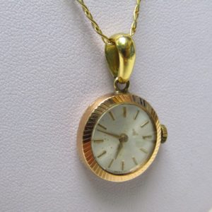 Cadena de Oro 18k. con Reloj Suizo de colgar, Radiant INCABLOC, lepine y remontoir. Pps. siglo XX.