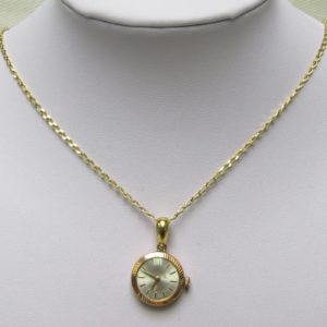 Cadena de Oro 18k. con Reloj Suizo de colgar, Radiant INCABLOC, lepine y remontoir. Pps. siglo XX.
