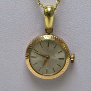 Cadena de Oro 18k. con Reloj Suizo de colgar, Radiant INCABLOC, lepine y remontoir. Pps. siglo XX.