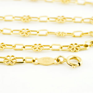 Conjunto de collar y pulsera en oro de 18k. Con eslabones calados.