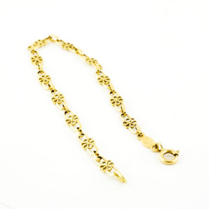 Conjunto de collar y pulsera en oro de 18k. Con eslabones calados.