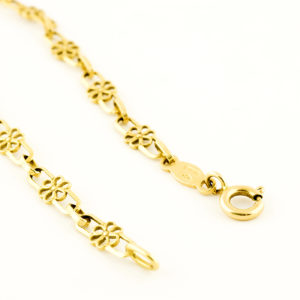 Conjunto de collar y pulsera en oro de 18k. Con eslabones calados.