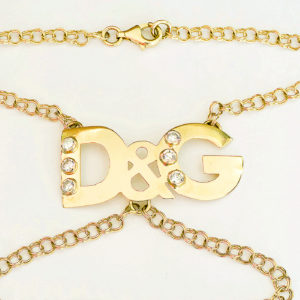 D&G. Pulsera mano-dedo en Oro de 18k. y circonitas.