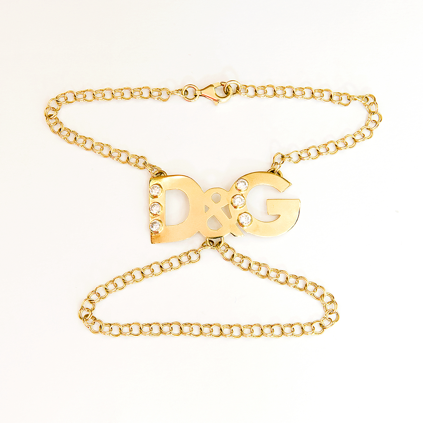 D&G. Pulsera mano-dedo en Oro de 18k. y circonitas. D&G. Pulsera mano-dedo en Oro de 18k. y circonitas.