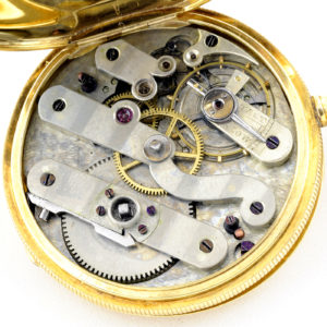 HUGUENIN. Reloj de bolsillo y colgar, saboneta. Circa, 1890.