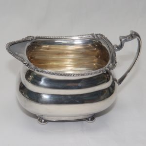 Juego Completo de Café y Té en plata, con mangos de madera ebonizada. España. Siglo XX. 5350 gr.