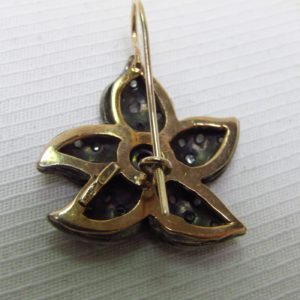 Pareja de Pendientes antiguos en Oro de 9k con rubí central y diamantes.