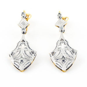 Pareja de pendientes de dos cuerpos, articulados, en Oro Bicolor y circonitas.