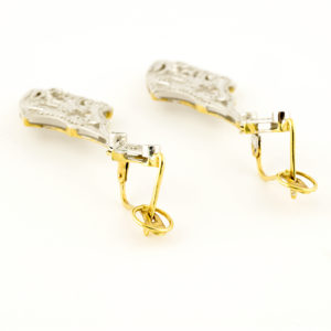 Pareja de pendientes de dos cuerpos, articulados, en Oro Bicolor y circonitas.