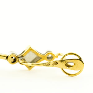 Pareja de pendientes de dos cuerpos, articulados, en Oro Bicolor y circonitas.