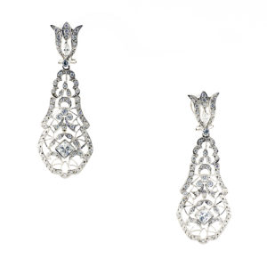Pareja de pendientes largos de dos cuerpos, articulados, en Oro Blanco y circonitas.