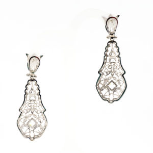 Pareja de pendientes largos de dos cuerpos, articulados, en Oro Blanco y circonitas.
