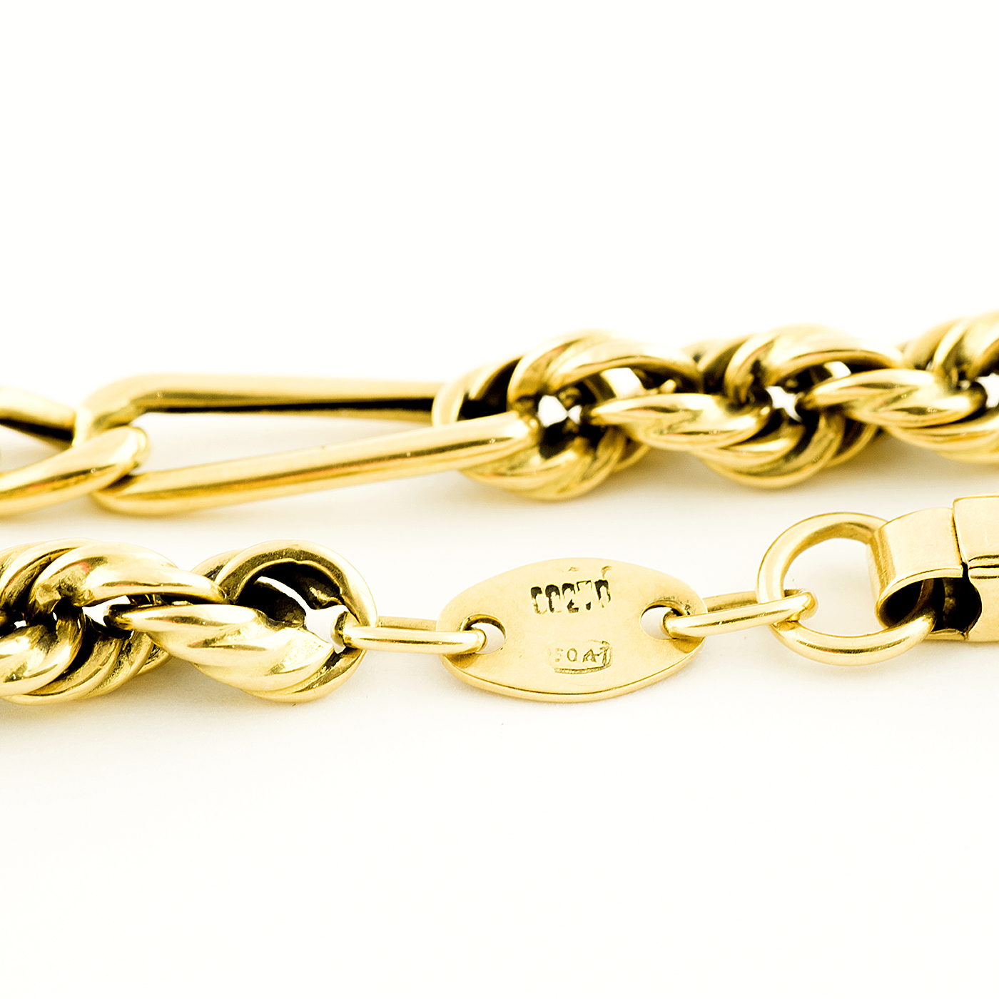 Pulsera Combinada, cordón y eslabones, en Oro de 18k. Pulsera Combinada, cordón y eslabones, en Oro de 18k.