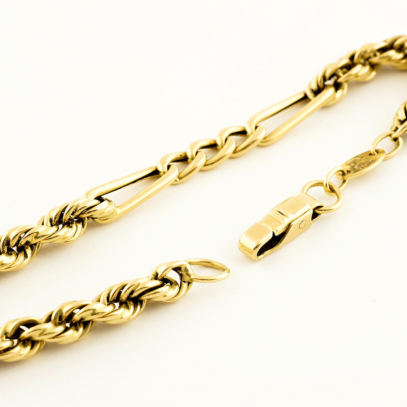 Pulsera Combinada, cordón y eslabones, en Oro de 18k. Pulsera Combinada, cordón y eslabones, en Oro de 18k.