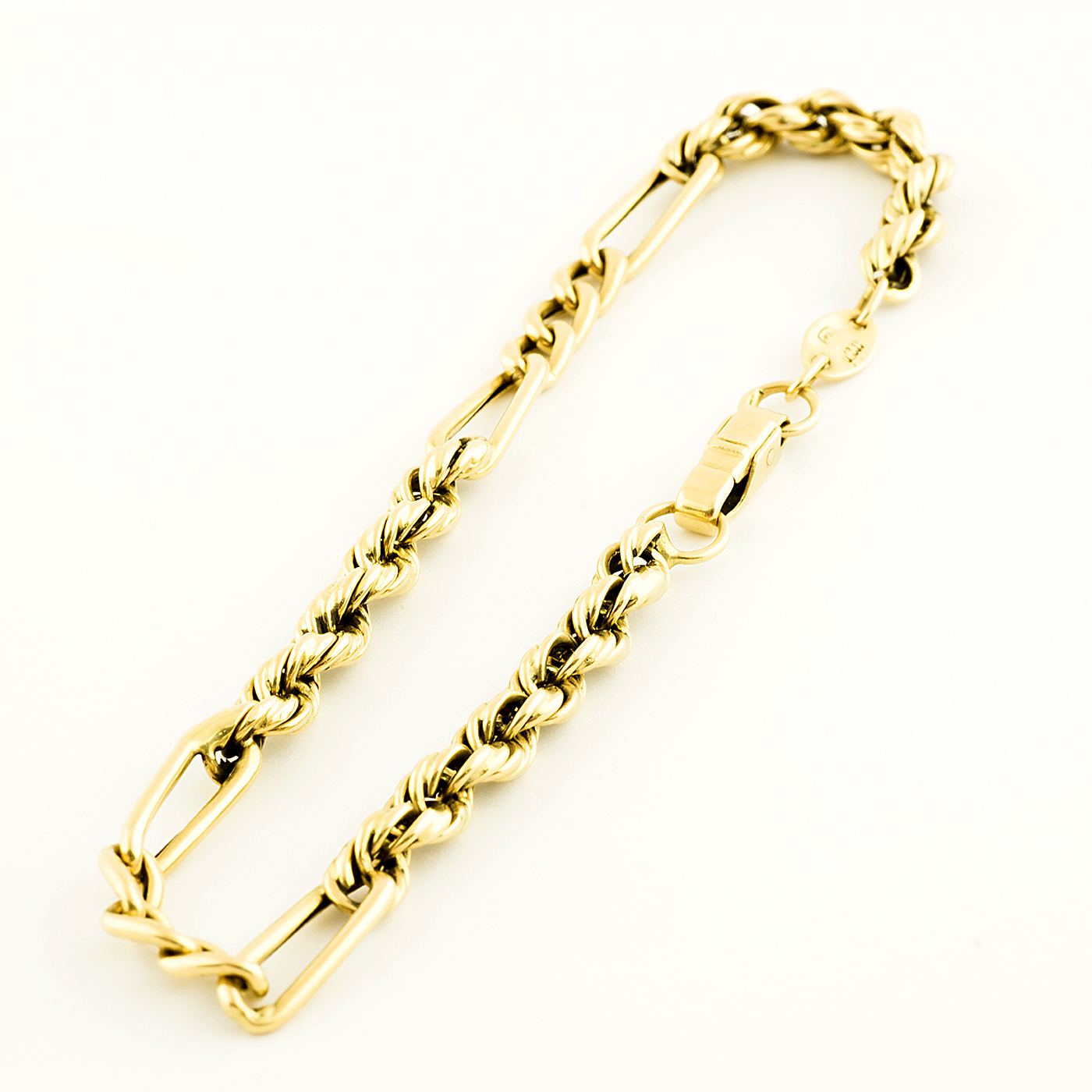 Pulsera Combinada, cordón y eslabones, en Oro de 18k. Pulsera Combinada, cordón y eslabones, en Oro de 18k.
