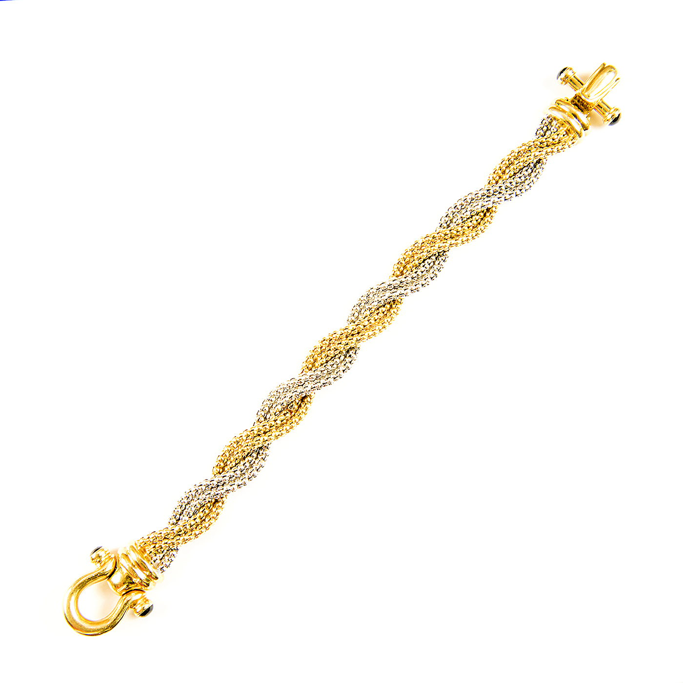 Pulsera en Oro Bicolor trenzada, con cabujón de zafiros. Pulsera en Oro Bicolor trenzada, con cabujón de zafiros.