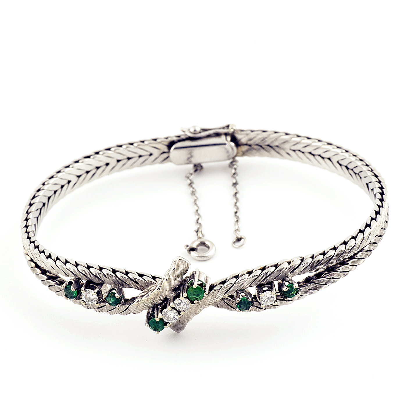 Pulsera en Oro Blanco con Cuatro Diamantes y Seis Esmeraldas. Pulsera en Oro Blanco con Cuatro Diamantes y Seis Esmeraldas.