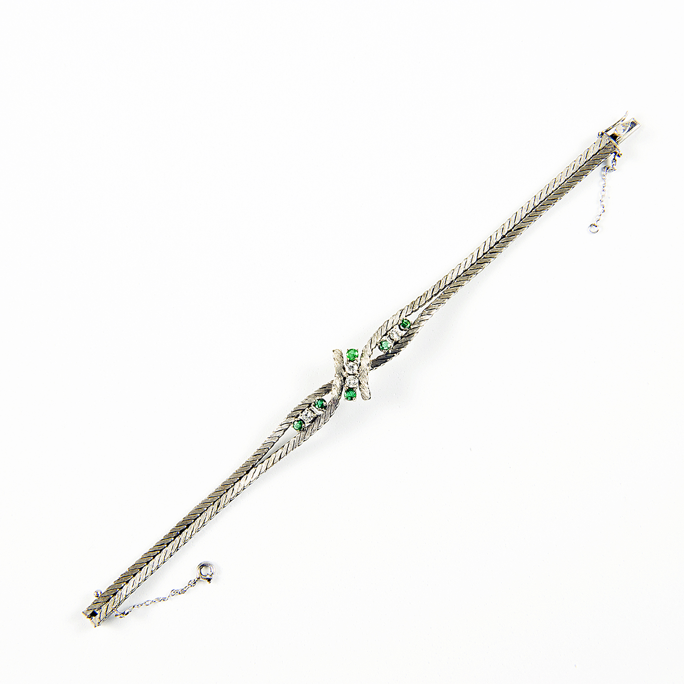 Pulsera en Oro Blanco con Cuatro Diamantes y Seis Esmeraldas. Pulsera en Oro Blanco con Cuatro Diamantes y Seis Esmeraldas.