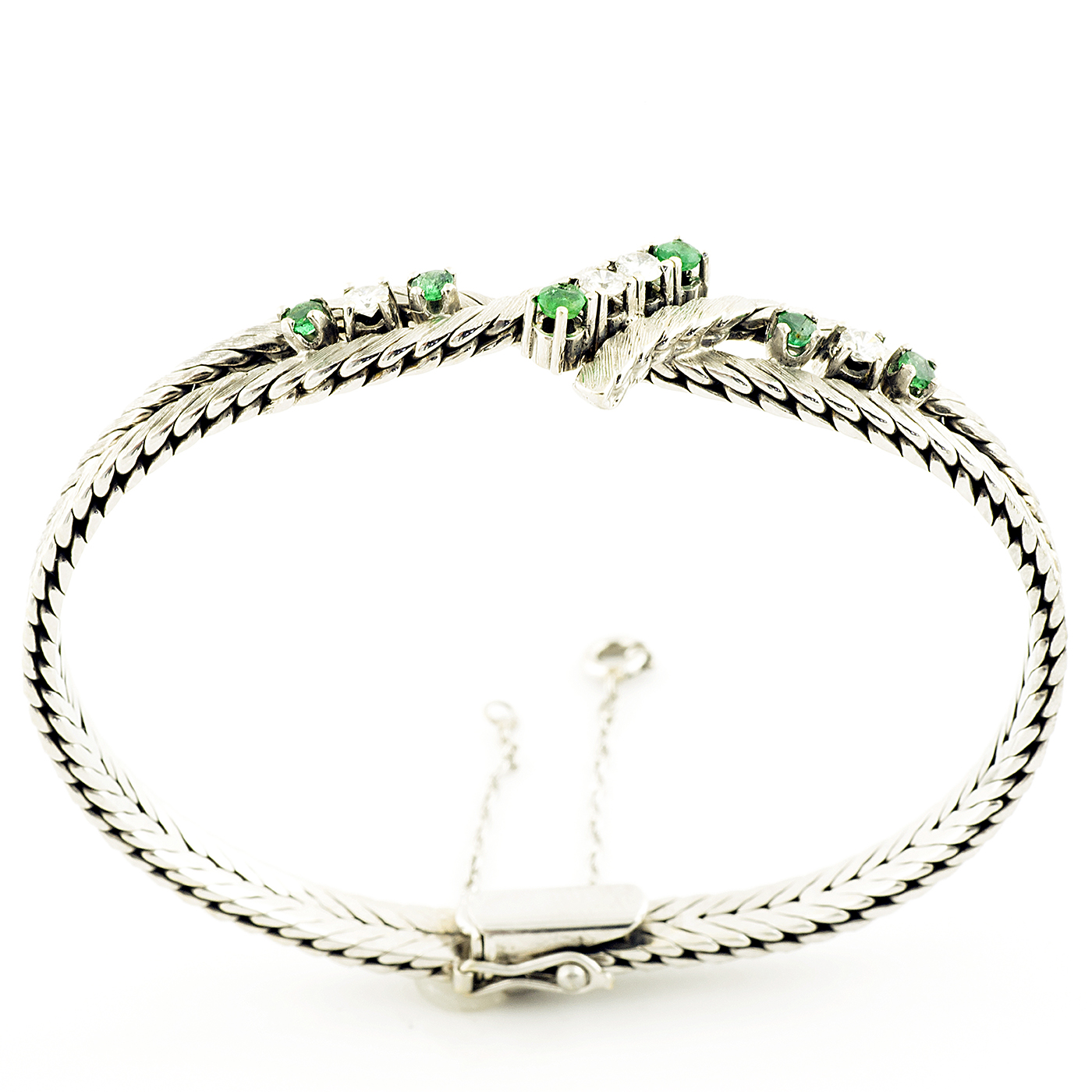 Pulsera en Oro Blanco con Cuatro Diamantes y Seis Esmeraldas. Pulsera en Oro Blanco con Cuatro Diamantes y Seis Esmeraldas.