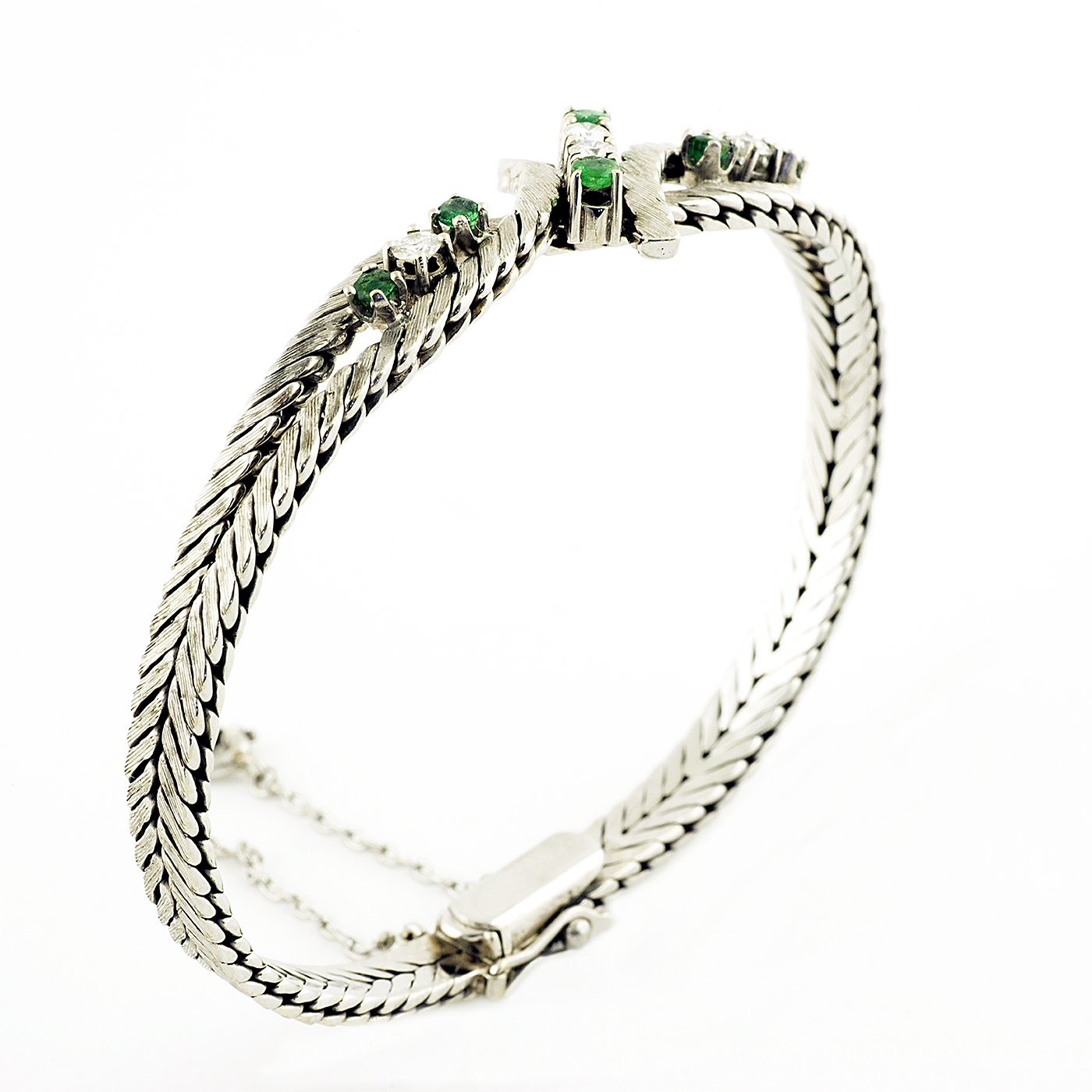 Pulsera en Oro Blanco con Cuatro Diamantes y Seis Esmeraldas. Pulsera en Oro Blanco con Cuatro Diamantes y Seis Esmeraldas.