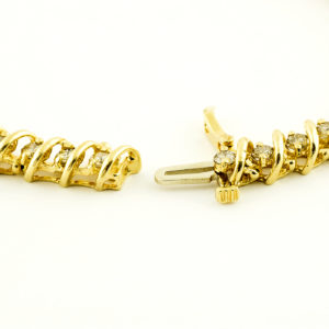 Pulsera Riviere, en Oro con 44 Diamantes talla Brillante de 2,42 ct. Color,L-M. Pureza:SI1-SI2