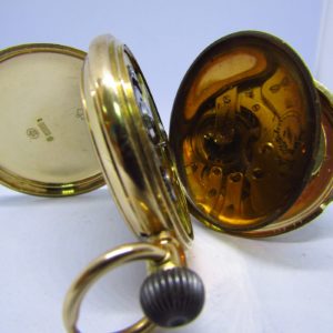 Reloj Suizo de Bolsillo, saboneta y remontoir. Oro 14k. Ca. 1890.