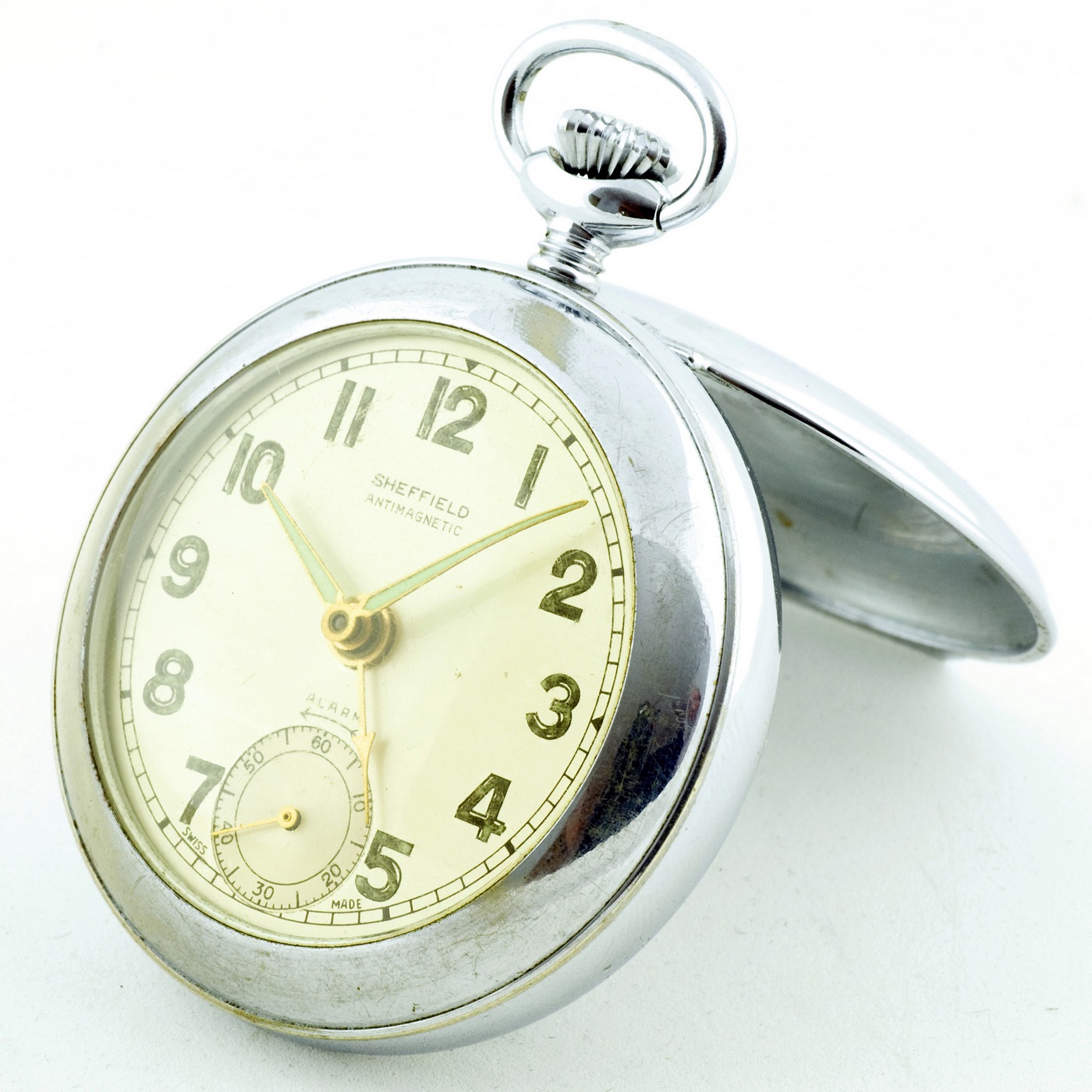 Reloj Suizo Despertador de bolsillo, sobremesa, lepine y remontoir. Sheffield, ca. 1940.