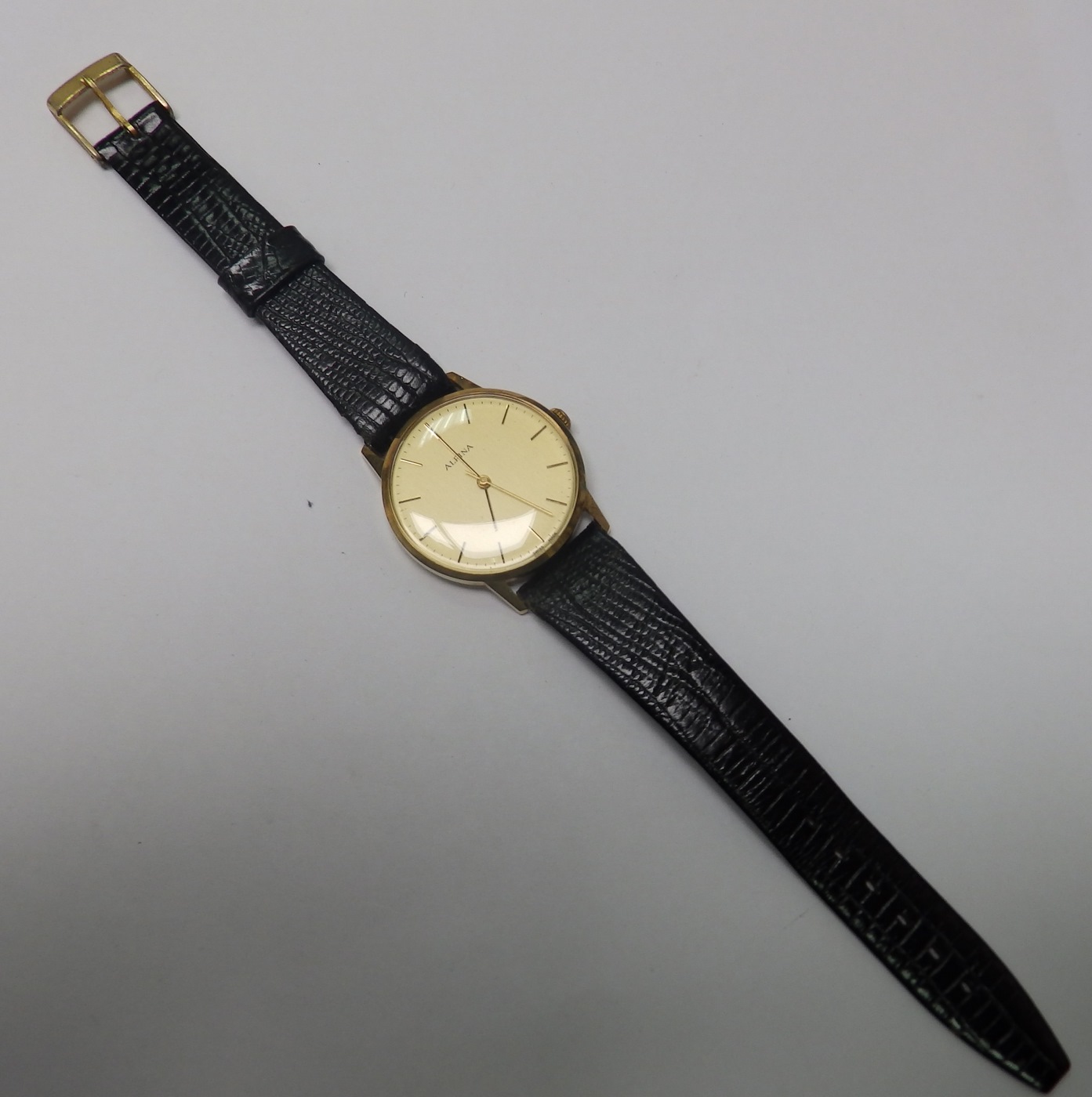 Alpina. Reloj de pulsera de caballero. Ca. 1980. Oro 14k. Peso: 24 gr. Alpina. Reloj de pulsera de caballero. Ca. 1980. Oro 14k. Peso: 24 gr.