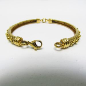 Brazalete Articulado artesanal en Oro de 18k. Longitud: 18 cm. Peso: 19 gr.