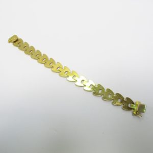 Brazalete estampado en Oro visto y Matizado de 18k. Longitud: 195 mm. Peso: 18,70 gr.