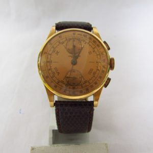 CHRONOGRAPHE SUISSE. Reloj Cronógrafo de pulsera para caballero. Oro 18k. Suiza, ca. 1950.