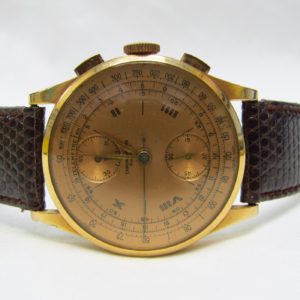 CHRONOGRAPHE SUISSE. Reloj Cronógrafo de pulsera para caballero. Oro 18k. Suiza, ca. 1950.