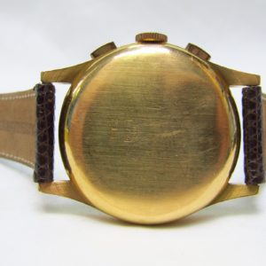 CHRONOGRAPHE SUISSE. Reloj Cronógrafo de pulsera para caballero. Oro 18k. Suiza, ca. 1950.