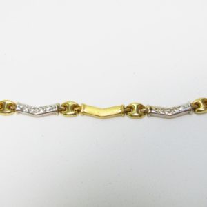 Collar con piezas onduladas en Oro Amarillo, mate y pulido y blanco,de 18K. Peso 16,43 gr.