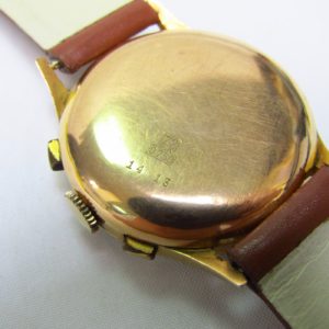 FLUDO. Reloj Cronógrafo de pusera para caballero. Fabricación suiza. Fecha ca. 1950.