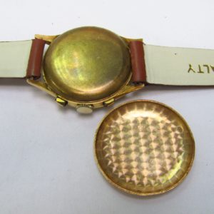 FLUDO. Reloj Cronógrafo de pusera para caballero. Fabricación suiza. Fecha ca. 1950.