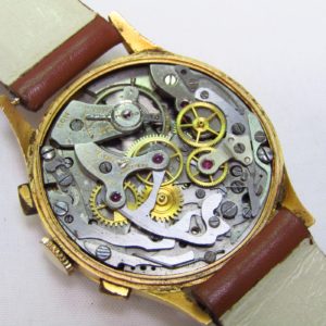 FLUDO. Reloj Cronógrafo de pusera para caballero. Fabricación suiza. Fecha ca. 1950.