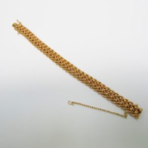 Pulsera de Oro, diseño tipo cordón con figuras de perlas. 18k.