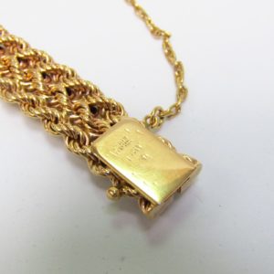 Pulsera de Oro, diseño tipo cordón con figuras de perlas. 18k.