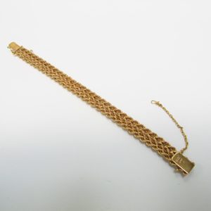 Pulsera de Oro, diseño tipo cordón con figuras de perlas. 18k.