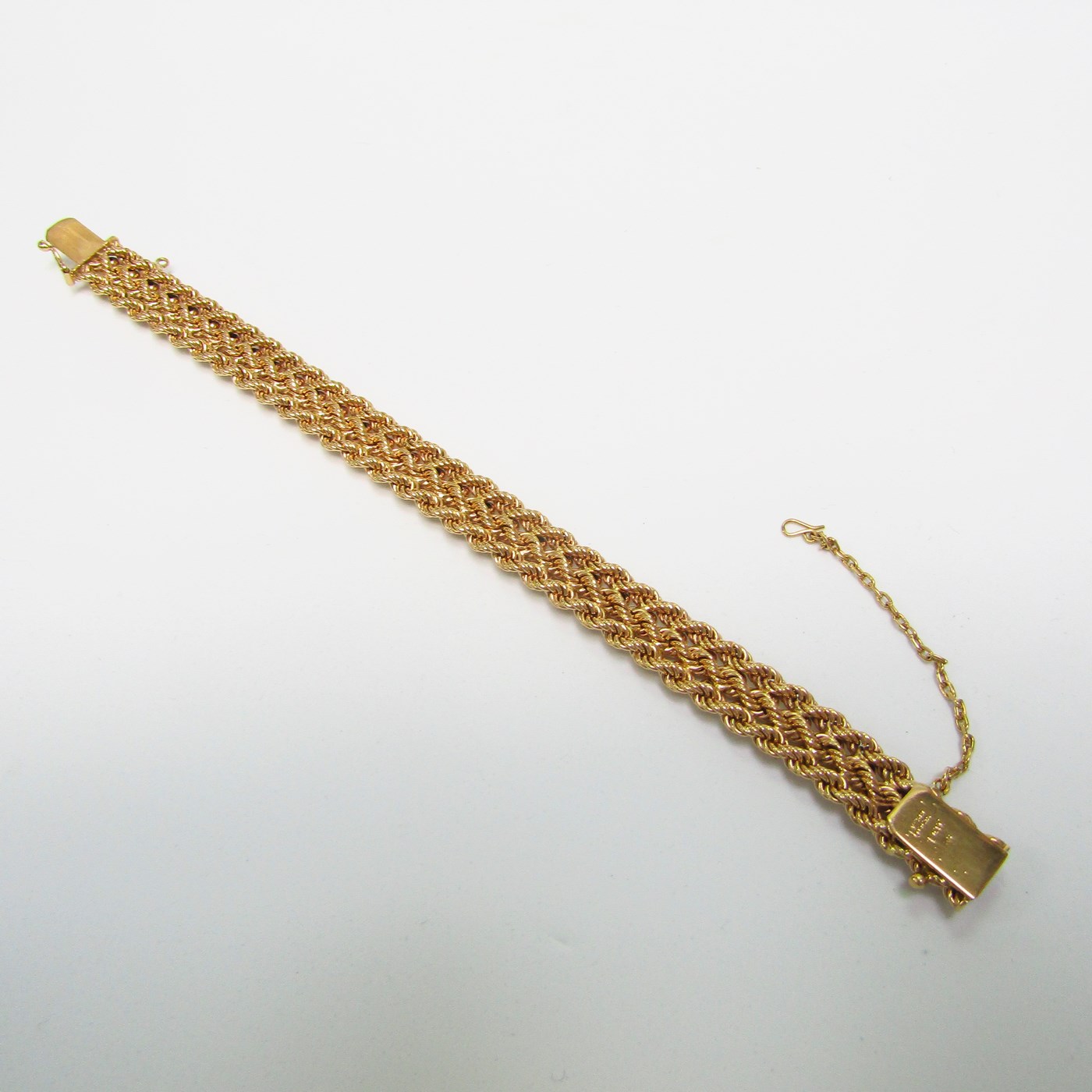Pulsera de Oro, diseño tipo cordón con figuras de perlas. 18k. Pulsera de Oro, diseño tipo cordón con figuras de perlas. 18k.