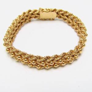Pulsera de Oro, diseño tipo cordón con figuras de perlas. 18k.