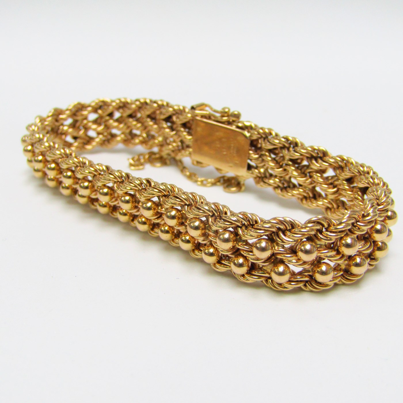 Pulsera de Oro, diseño tipo cordón con figuras de perlas. 18k. Pulsera de Oro, diseño tipo cordón con figuras de perlas. 18k.