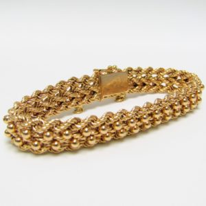 Pulsera de Oro, diseño tipo cordón con figuras de perlas. 18k.