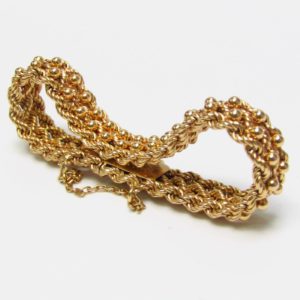 Pulsera de Oro, diseño tipo cordón con figuras de perlas. 18k.