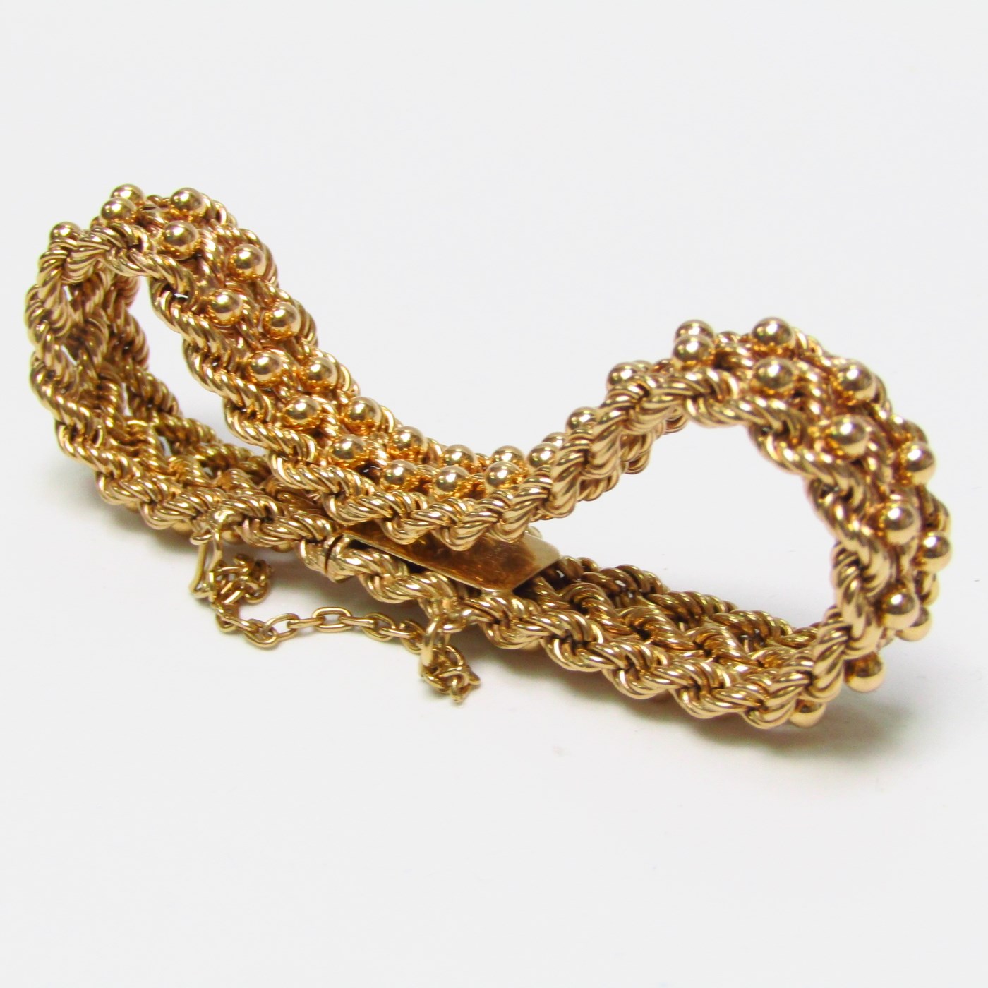 Pulsera de Oro, diseño tipo cordón con figuras de perlas. 18k. Pulsera de Oro, diseño tipo cordón con figuras de perlas. 18k.
