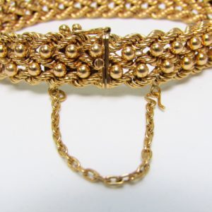 Pulsera de Oro, diseño tipo cordón con figuras de perlas. 18k.
