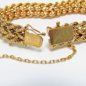 Pulsera de Oro, diseño tipo cordón con figuras de perlas. 18k.